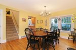 Formal dining is open to the living room and adjacent to the kitchen